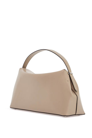 Toteme beige minimalist leather bag with top handle and geometric shape