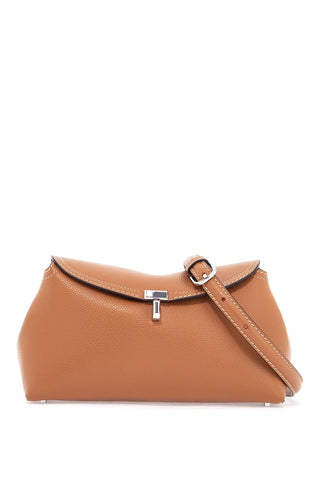 Toteme tan leather clutch with t-lock closure and adjustable shoulder strap